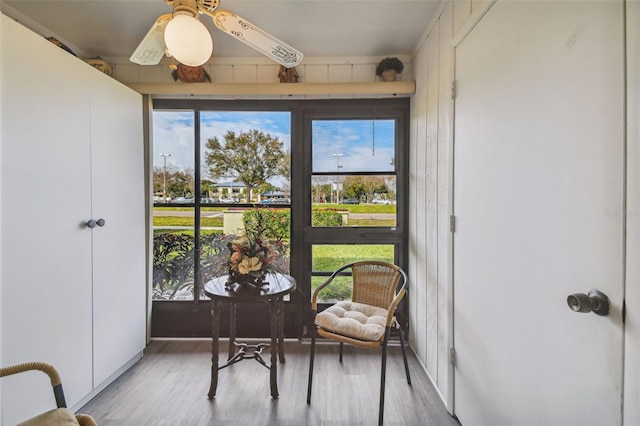 sunroom / solarium featuring ceiling fan and a wealth of natural light