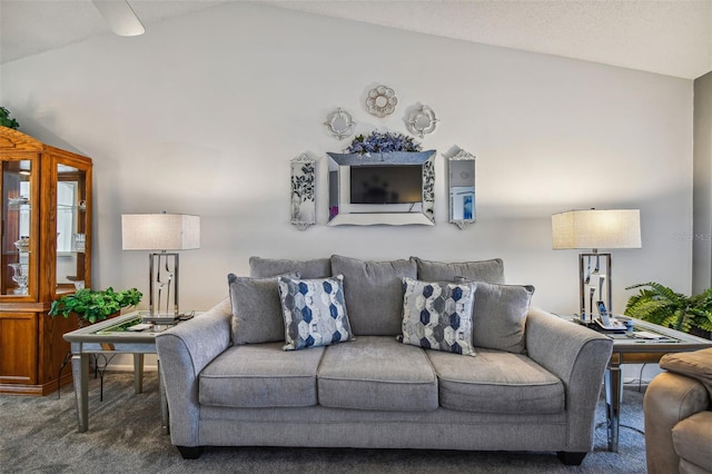 living room featuring carpet flooring and lofted ceiling