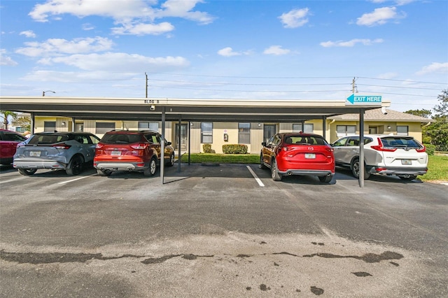 view of parking / parking lot with a carport