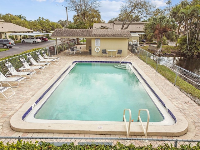 view of swimming pool with a patio