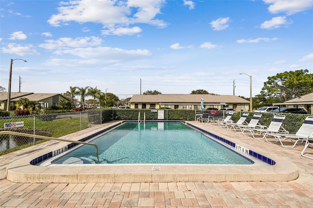 view of swimming pool with a patio