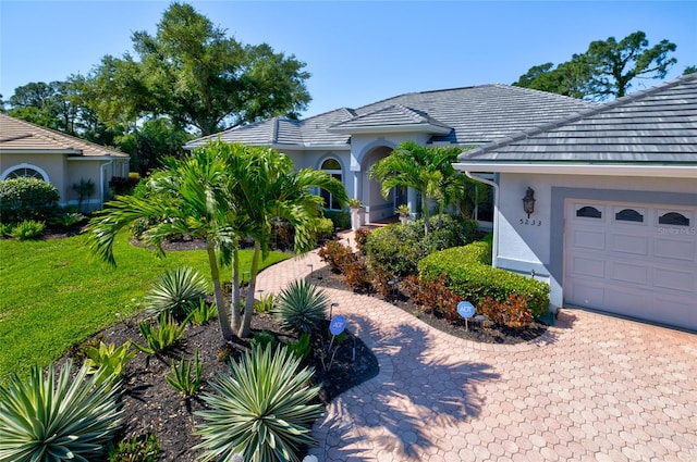 view of front of property with a garage