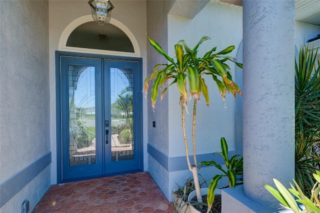 entrance to property featuring french doors