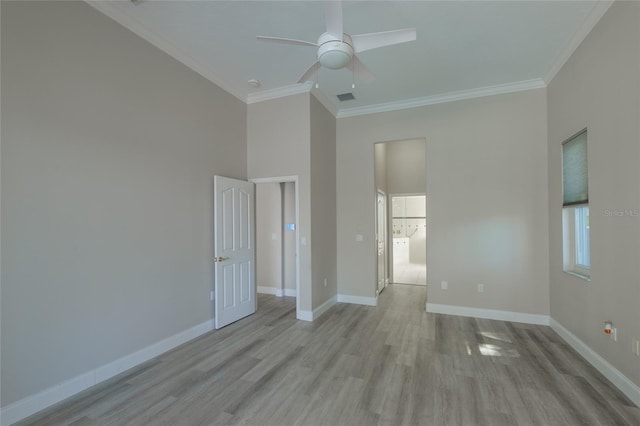 unfurnished room with crown molding, ceiling fan, and light hardwood / wood-style flooring