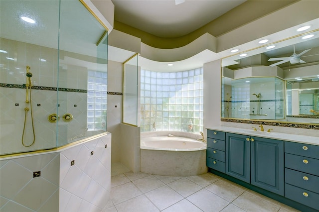 bathroom with ceiling fan, tile floors, plus walk in shower, and vanity