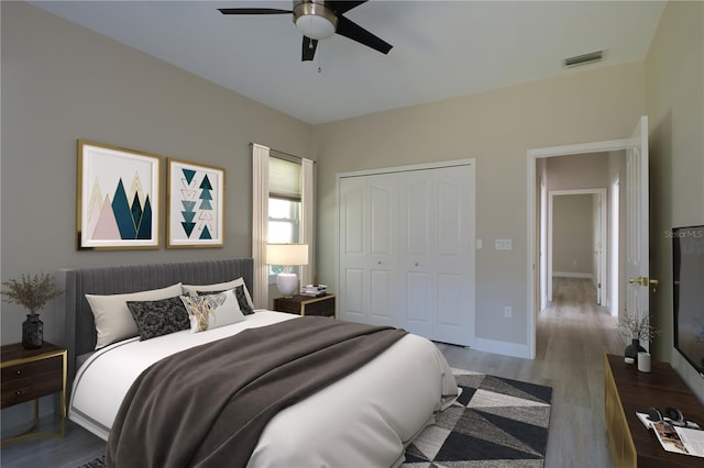 bedroom featuring a closet, ceiling fan, and wood-type flooring