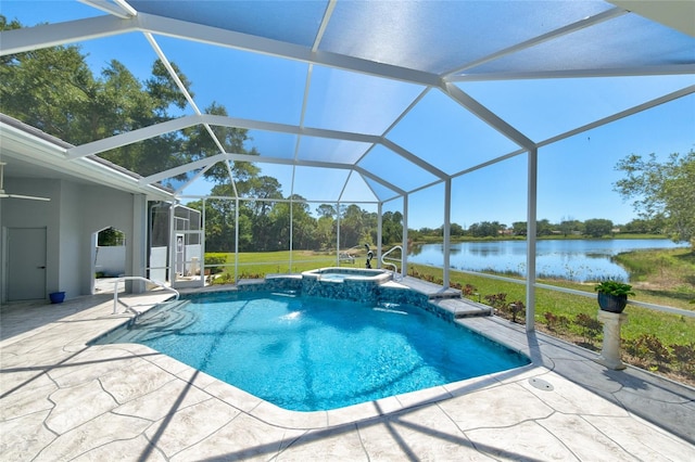 view of pool with an in ground hot tub, a water view, a patio, and a lanai