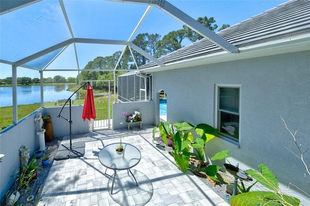 unfurnished sunroom with a water view