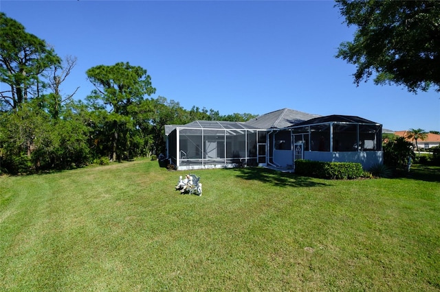 view of yard with glass enclosure