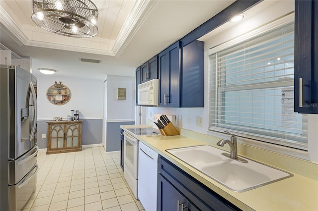 kitchen with blue cabinetry, a tray ceiling, white appliances, crown molding, and sink