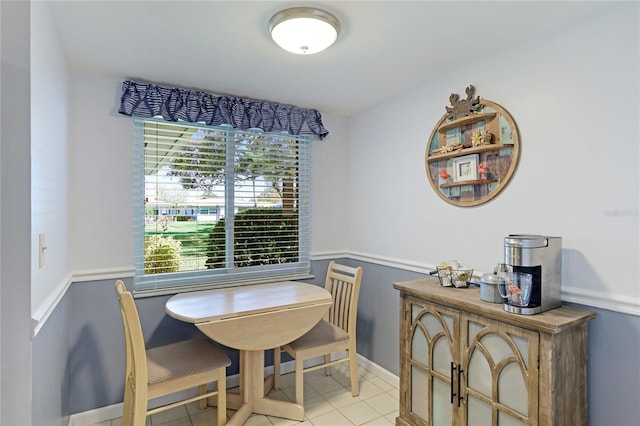 dining area featuring light tile patterned flooring