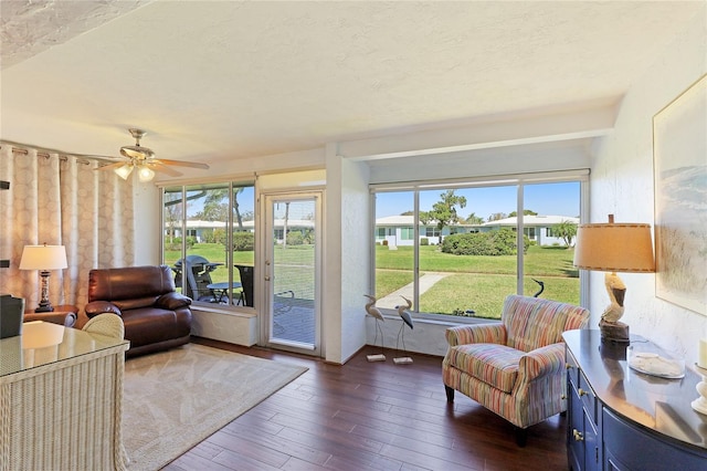 sunroom featuring ceiling fan