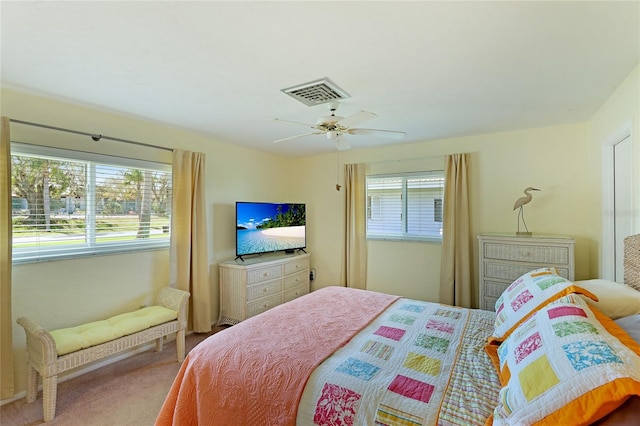 carpeted bedroom featuring ceiling fan