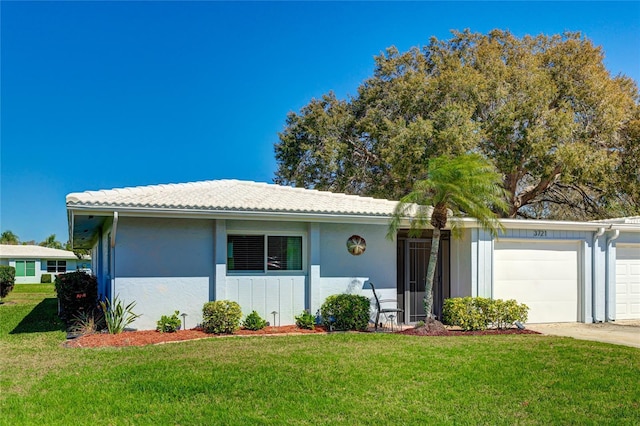 ranch-style house with a front lawn and a garage