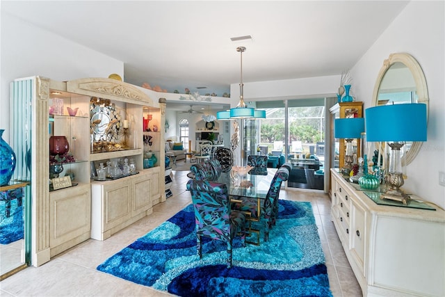 dining space featuring visible vents, plenty of natural light, and light tile patterned floors