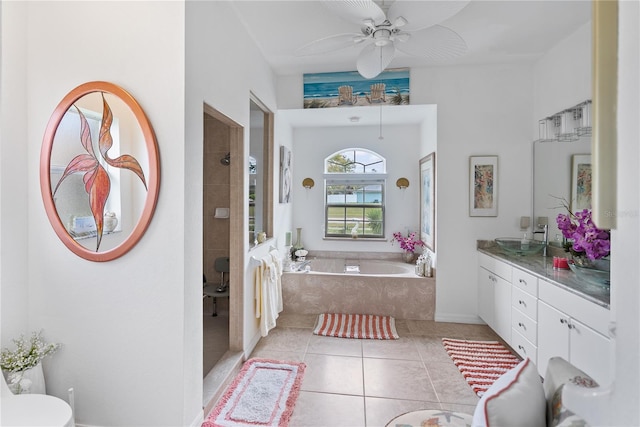 bathroom with a garden tub, ceiling fan, vanity, tiled shower, and tile patterned floors