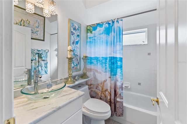 full bathroom featuring toilet, shower / tub combo with curtain, and vanity