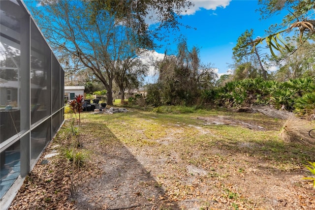 view of yard featuring a lanai