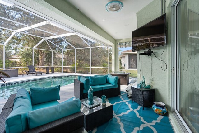 outdoor pool with a lanai, an outdoor living space, and a patio