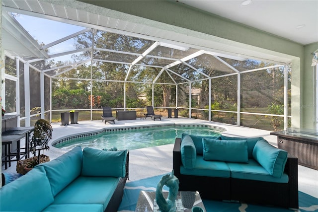 outdoor pool with a patio and an outdoor hangout area