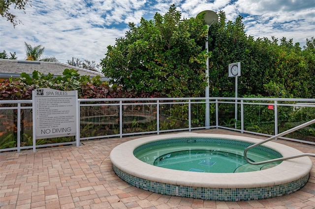 view of pool with a community hot tub