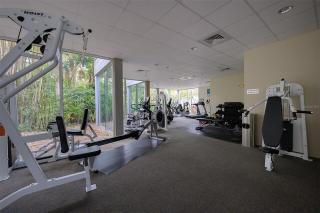 workout area with a drop ceiling