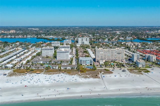 bird's eye view featuring a water view and a view of the beach