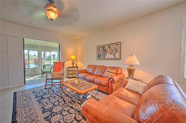 living room featuring tile flooring and ceiling fan