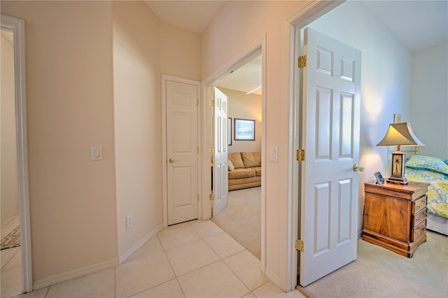 hallway featuring light tile flooring