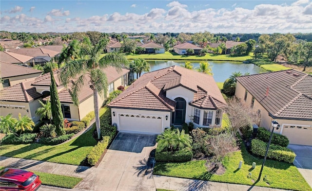 view of front facade featuring a front yard and a water view