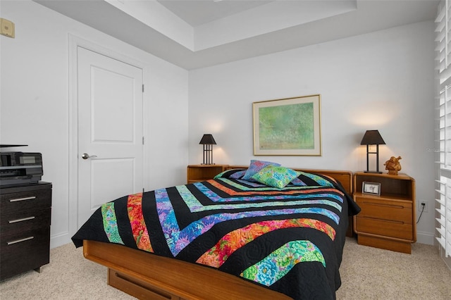 bedroom with light colored carpet