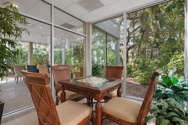 sunroom featuring a paneled ceiling