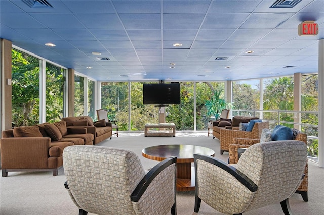 sunroom / solarium featuring a paneled ceiling