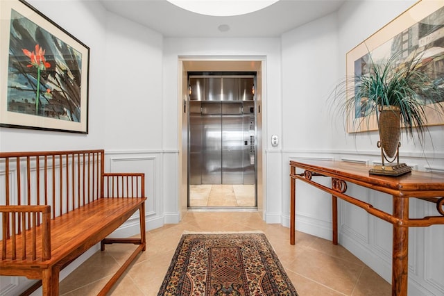 corridor featuring light tile patterned floors