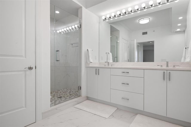 bathroom with vanity, crown molding, and walk in shower