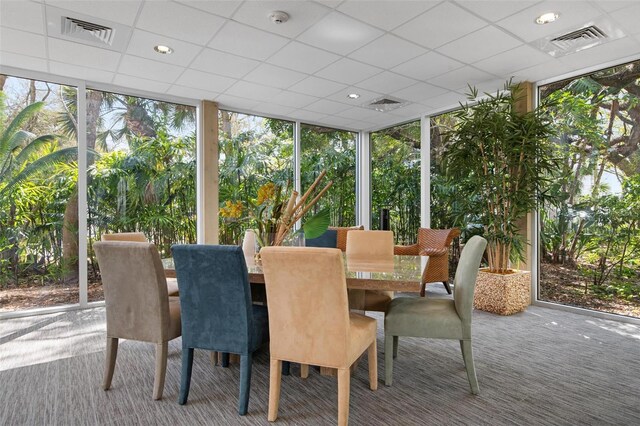 sunroom featuring a drop ceiling