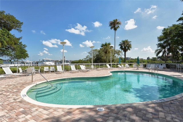 view of swimming pool featuring a patio area