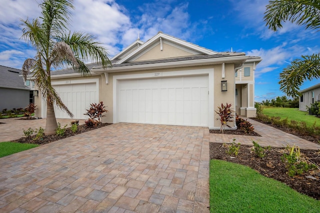 ranch-style home featuring a garage