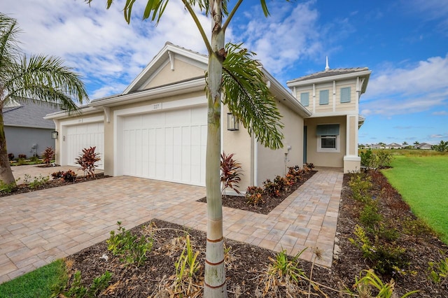 view of front facade with a front yard and a garage