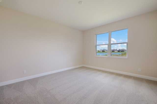 empty room featuring light carpet