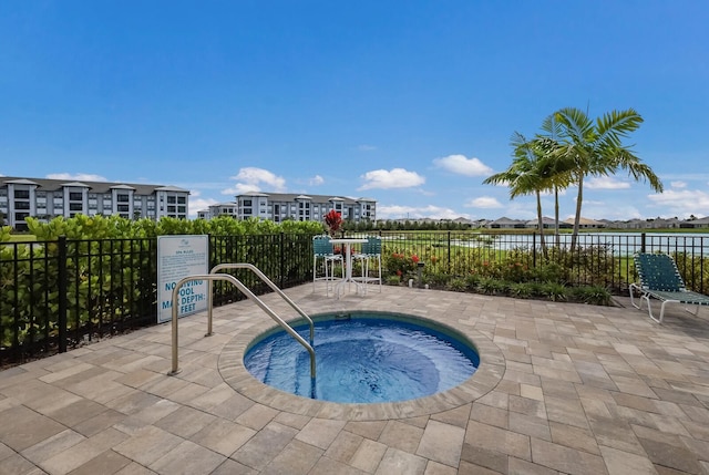 view of swimming pool with a community hot tub and a patio