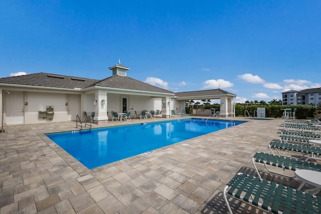 view of swimming pool featuring a patio area