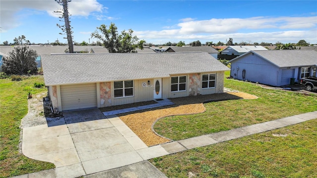 ranch-style home with a front yard and a garage