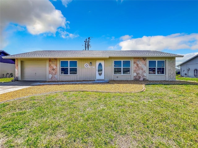 single story home with a front lawn and a garage