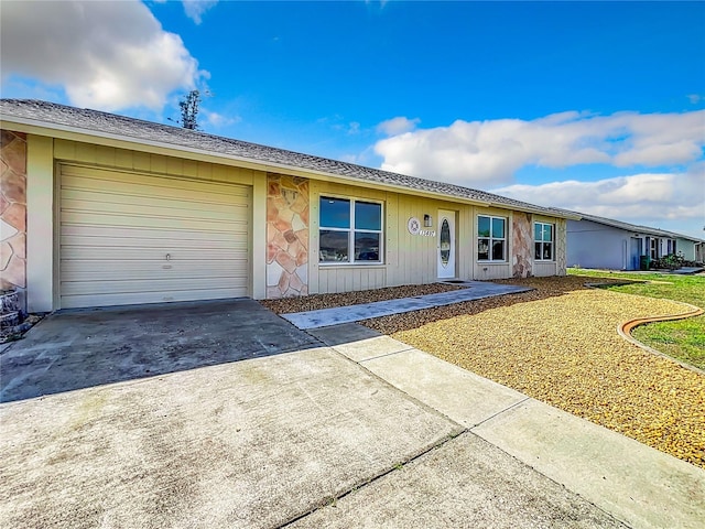 single story home with a front lawn and a garage