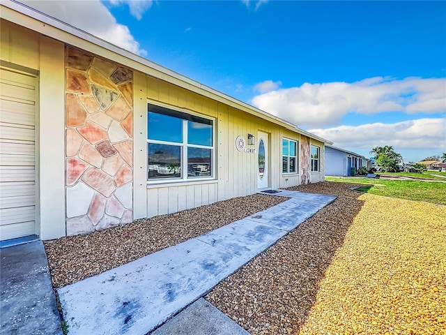 view of property exterior with a yard