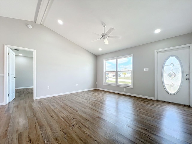 entryway with ceiling fan, light hardwood / wood-style flooring, high vaulted ceiling, and beamed ceiling