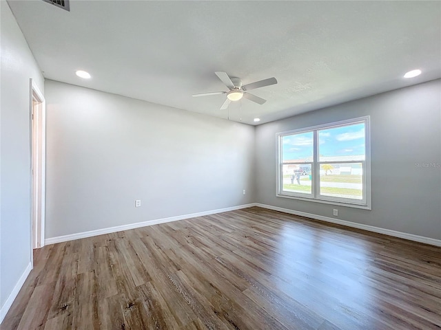 spare room with light hardwood / wood-style flooring and ceiling fan