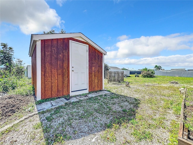 view of shed / structure with a lawn