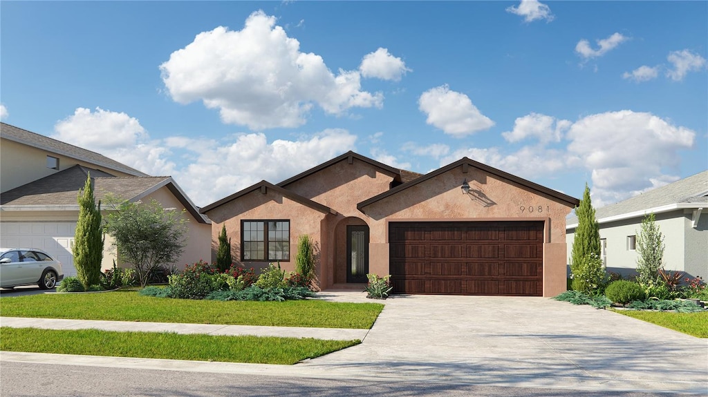 view of front of home with a front lawn and a garage